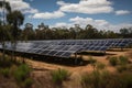 a solar farm, with rows of panels and inverters visible Royalty Free Stock Photo