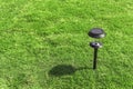 Solar lamp in the garden with shadow.