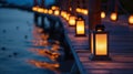 Solar lanterns lining a boardwalk along a beach offering a warm and inviting glow at night Royalty Free Stock Photo