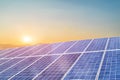 Solar panel against sunset background. Photovoltaic, alternative electricity source. Royalty Free Stock Photo