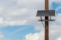 Solar panel attached to telephone pole Royalty Free Stock Photo