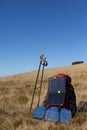 The solar panel attached to the tent. The man sitting next to mobile phone charges from the sun. Royalty Free Stock Photo