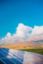 Solar panel on the background of mountains. sustainable development of new energy in agriculture Royalty Free Stock Photo