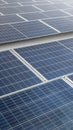 A solar panel or solar cell is shown in a close up. The panel is blue and has a grid pattern. Photovoltaic module