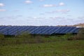 Solar panel farm produces green environmentally friendly energy Royalty Free Stock Photo