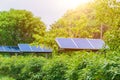 Solar panel in the forest power tower around with green tree in countryside area