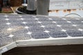 Solar panel in great state of degradation. Unused and discarded objects, old scrap. Royalty Free Stock Photo