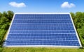Solar panel installed on green lawn under blue sky Royalty Free Stock Photo