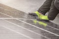 The solar panel installer connects the modules together. Installation work on the roof, connection and installation of Royalty Free Stock Photo