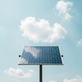 Solar panel mounted on a single pole against a clear blue sky with scattered fluffy Royalty Free Stock Photo
