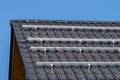 Solar Panel Mounting Frame on Tiled Roof Royalty Free Stock Photo