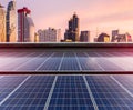 Solar Panel Photovoltaic installation on a Roof of factory, sunny blue sky background, alternative electricity source -