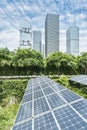 Solar Panel Photovoltaic installation with urban landscape landmarks, alternative electricity source Royalty Free Stock Photo