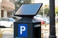 Solar panel powered urban parking meter Royalty Free Stock Photo