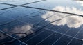 Solar Panel Reflection with Water Droplets Under Cloudy Sky Royalty Free Stock Photo