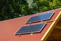 Solar panel on the roof of the house. Red tiles. Royalty Free Stock Photo