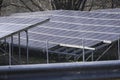Solar Panel in Spring Behind Metal Fence and five Solar Panels missing Royalty Free Stock Photo