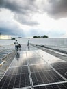 Solar panel technician and engineer working on installing solar panel. Renewable energy