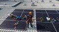 Solar Panel Technician Installing on Rooftop Royalty Free Stock Photo