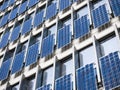 Solar Panel wall on Building Facade clean Energy Industrial utility system Technology background Royalty Free Stock Photo