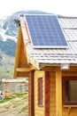 Solar panel on the wooden roof at mountrain area house Royalty Free Stock Photo