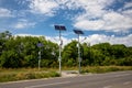 Solar panels above the highway to illuminate the road. Renewable energy with the help of the sun