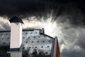 Solar Panels on the Roof of a House with Storm Clouds on Background Royalty Free Stock Photo