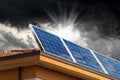 Solar Panels on the Roof of a House with Storm Clouds on Background Royalty Free Stock Photo