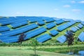 Solar panels against blue sunny sky produce green, environmentally friendly energy from sun. Blue solar panel background of Royalty Free Stock Photo