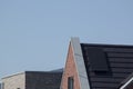 Solar panels on a dutch roof against a clear blue sky on a summer day Royalty Free Stock Photo