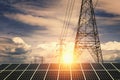 Solar panels with electricity pylon and sunset. Clean power energy concept Royalty Free Stock Photo