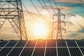 Solar panels with electricity pylon and sunset. Clean power energy concept Royalty Free Stock Photo
