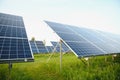 Solar panels energy farm on sky background. Royalty Free Stock Photo