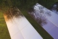 Solar panels in the fog among green trees Royalty Free Stock Photo