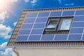 Solar panels for green energy on the tiled roof of suburban house, Photovoltaic module and regenerative energy system Royalty Free Stock Photo
