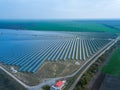 Solar panels in green field. Drone view. Alternative energy, ecology power conservation concept Royalty Free Stock Photo