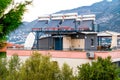 Solar panels heat water in barrels installed on roof of residential house, concept of eco-friendly energy Royalty Free Stock Photo