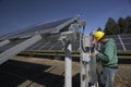 Solar panels inspected by workman Royalty Free Stock Photo