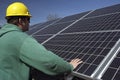 Solar panels inspected by workman Royalty Free Stock Photo