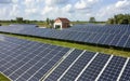 Solar panels installed on a house roof, harnessing renewable energy from sunlight to power households Royalty Free Stock Photo