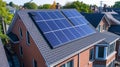 Solar panels installed on the roof of a house. Photovoltaic modules for renewable electric energy production. Royalty Free Stock Photo