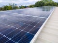 Solar panels installed on a roof of a large industrial building or a warehouse Royalty Free Stock Photo