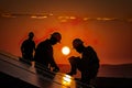 Solar Panels Installing By Silhouette Workers In Front Of Sunset - Generative AI