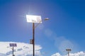 Solar panels on lamp posts reflecting sunlight renewable energy with blue sky