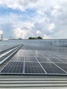 Solar panels of photovoltaic power station or solar park for the supply of electricity on a roof of factory Royalty Free Stock Photo