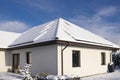 Solar panels on a private house covered with snow