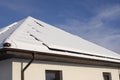 Solar panels on a private house covered with snow