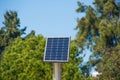 Solar panels in public park backgound. Photovoltaic modules for renewable energy, system of electric generators from the sun. Royalty Free Stock Photo