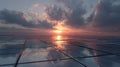 Solar panels reflecting colorful sunset sky with dramatic clouds at dusk Royalty Free Stock Photo