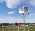 Solar panels by the road. Solar-powered street lights. An environmentally friendly source of energy. Royalty Free Stock Photo